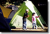 Kids playing in front of a tent
